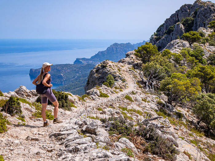 Woman looking at a peaceful Mediterranean landscape